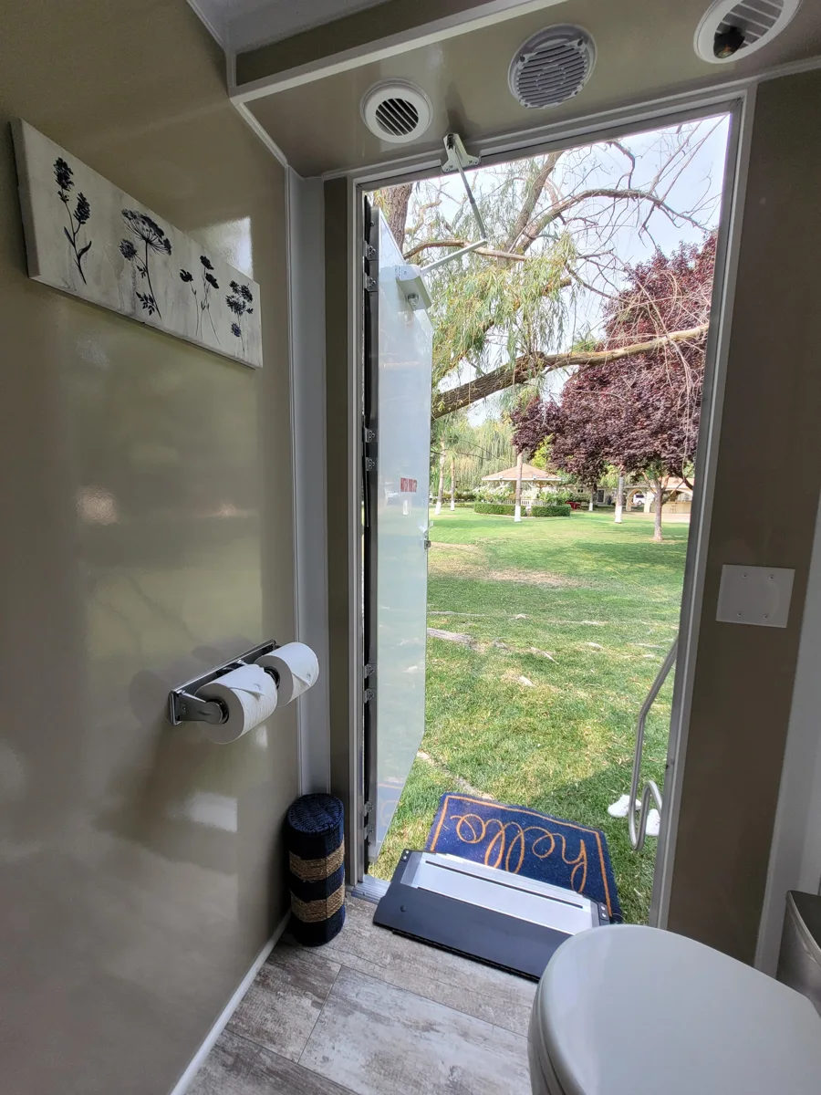 Interior view toward a private entrance and the overhead fittings.
