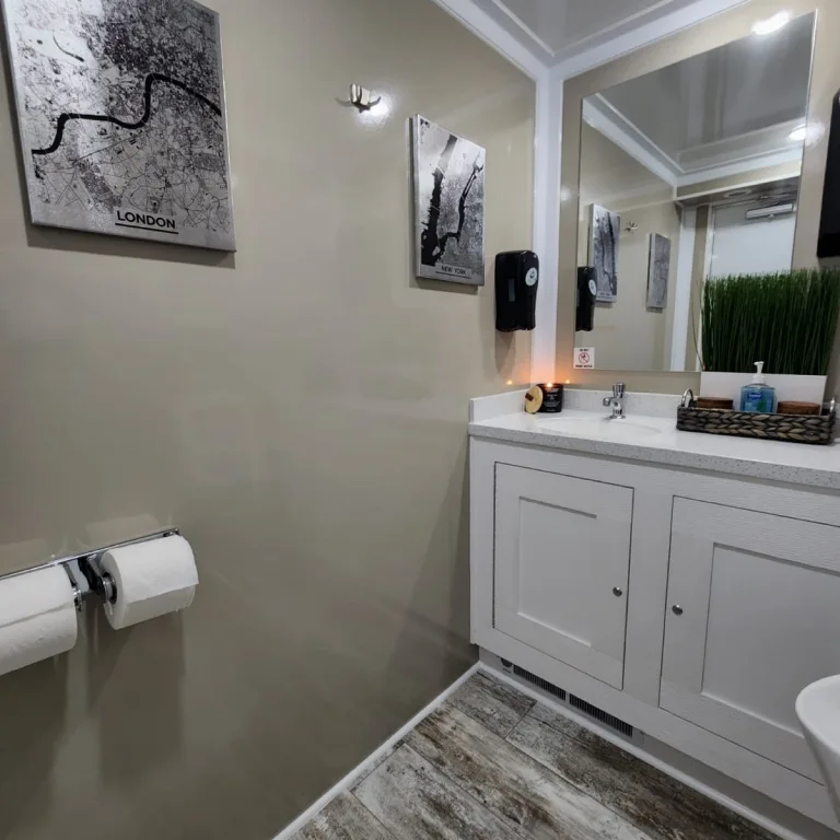 Interior lighting above the vanity and wall decor.
